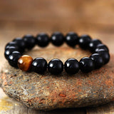 Krachtige zwarte onyx en tijgeroog rek armband voor bescherming en kracht - Moon Dance Charms